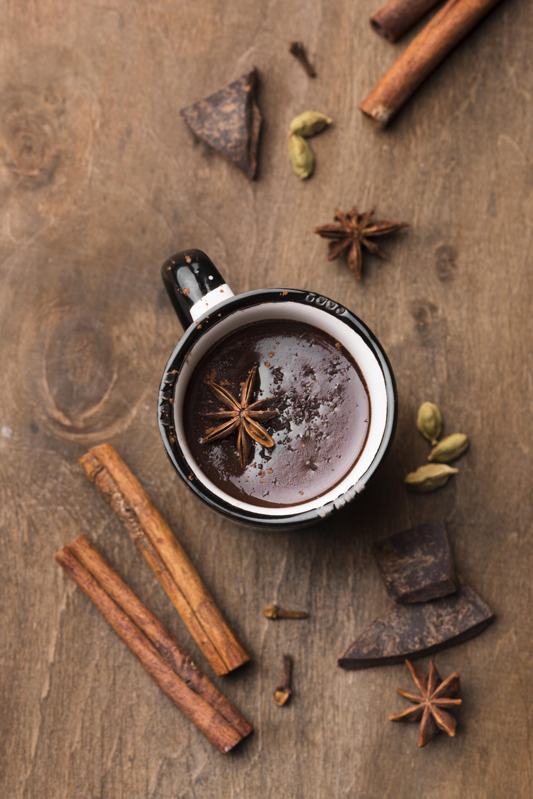 top view cup with hot chocolate cinnamon table